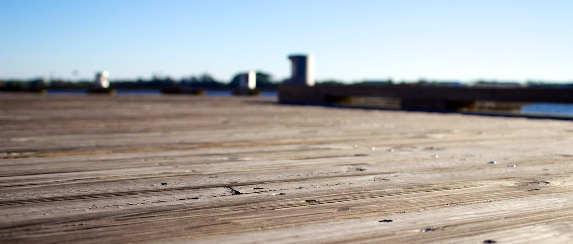 Wooden deck with blurred background view.